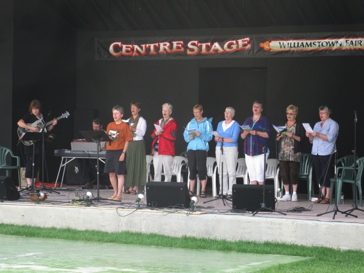 Leading the crowd in song.