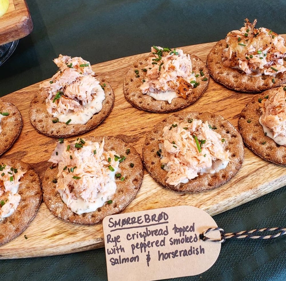 Smorrebrod: Rye crispbread topped with peppered smoked salmon and horseradish