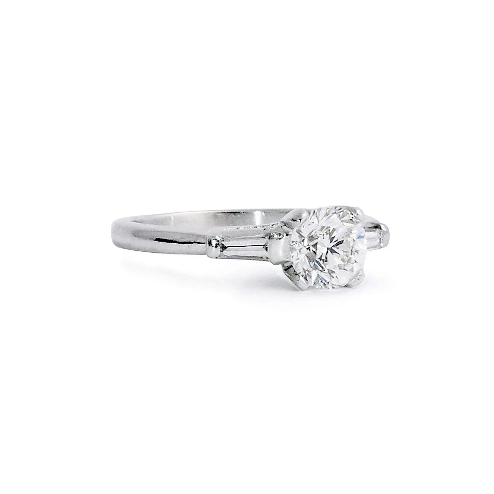 Round Brilliant Solitaire Engagement Ring With Tapered Baguettes