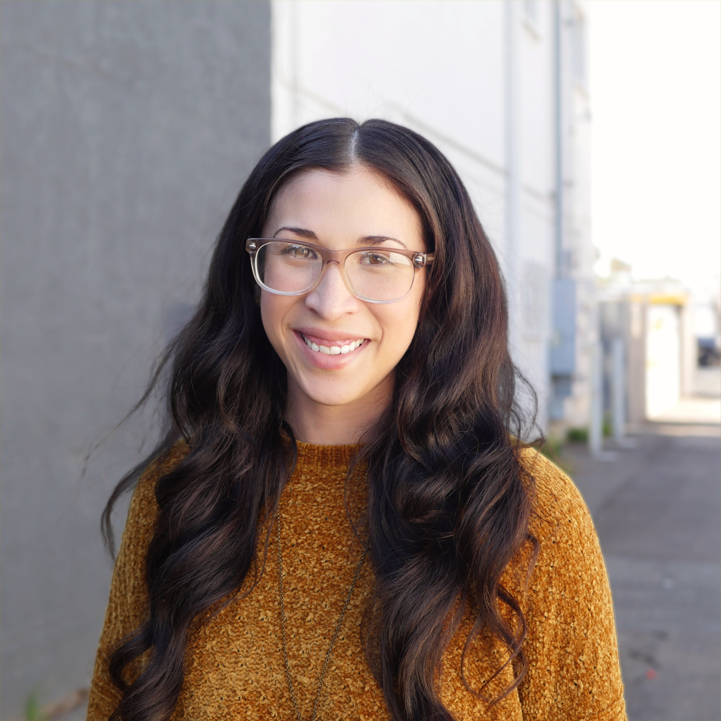 Margaret Hernandez smiling in front of 530 Coast Highway
