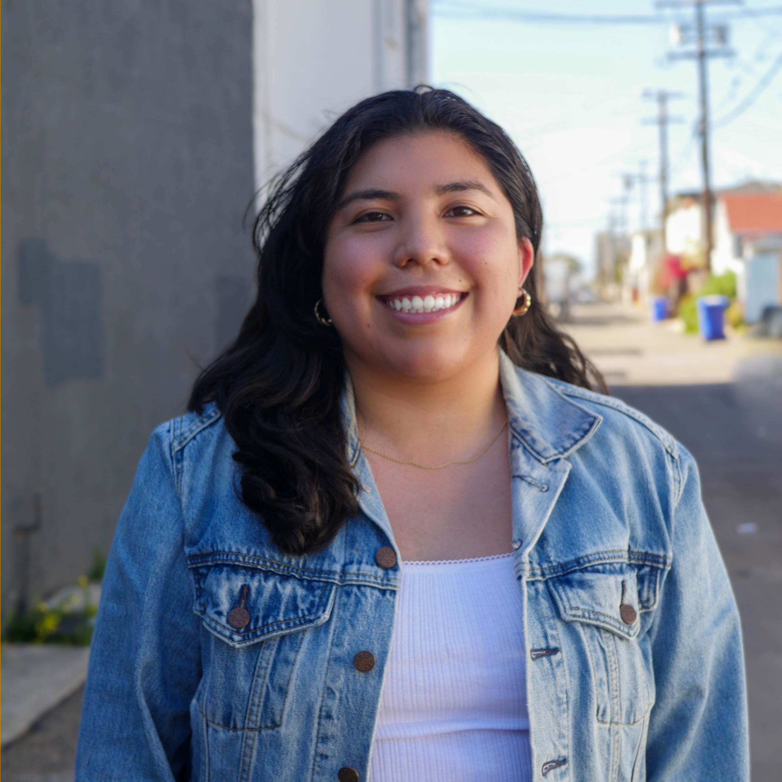 Astrid Gonzales smiling in front of 530 Coast Highway