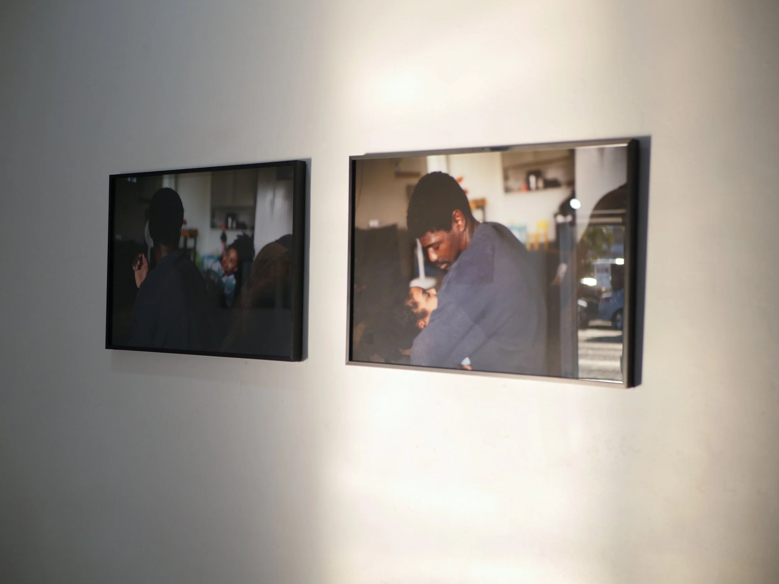 2 gallery photographs featuring father and daughter in their home