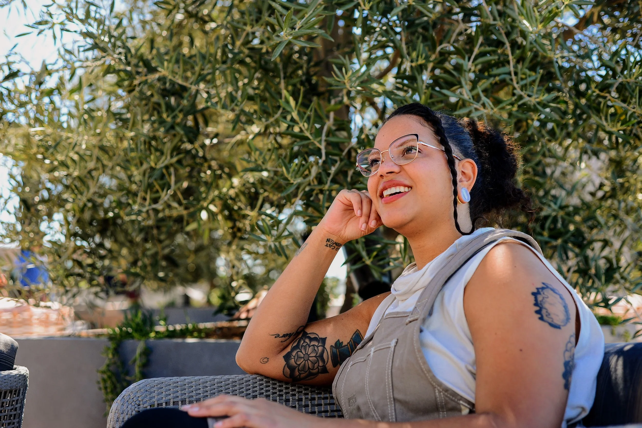 Akiko Surai sitting outside and smiling