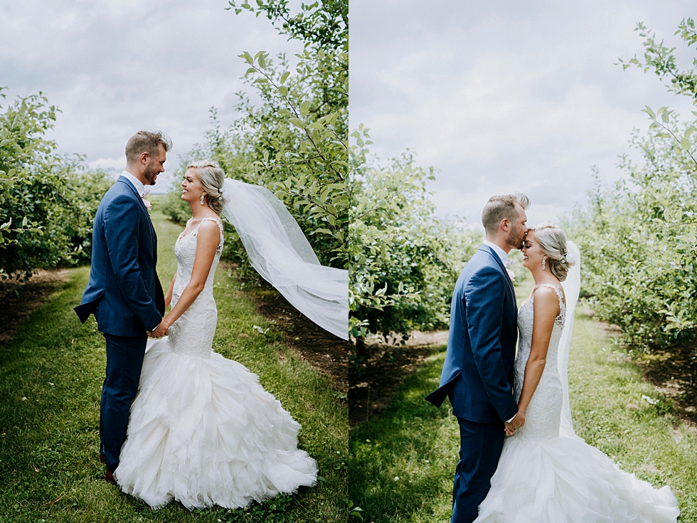  Charming southern bride and groom in the midst of trees at Huber’s orchard and winery in Louisville Kentucky. Huber’s orchard and winery spring wedding Louisville Kentucky wedding photography by Lauren outdoor wedding ceremony bride and groom #weddi