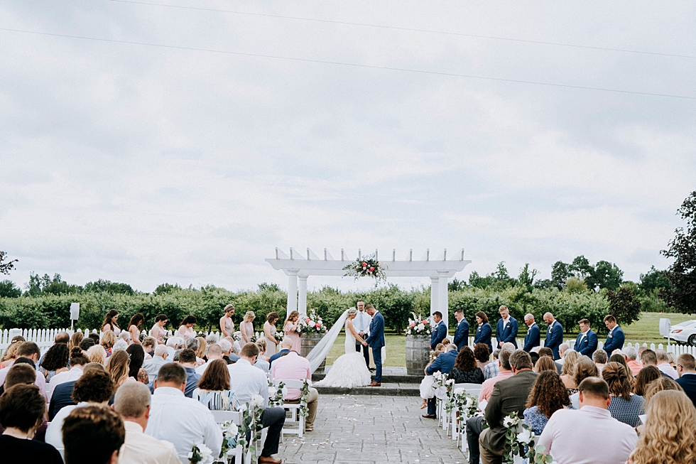  Stunning outdoor ceremony at Huber’s orchard and winery in Louisville Kentucky. Huber’s orchard and winery spring wedding Louisville Kentucky wedding photography by Lauren outdoor wedding ceremony bride and groom #weddingphotographer #louisvillephot