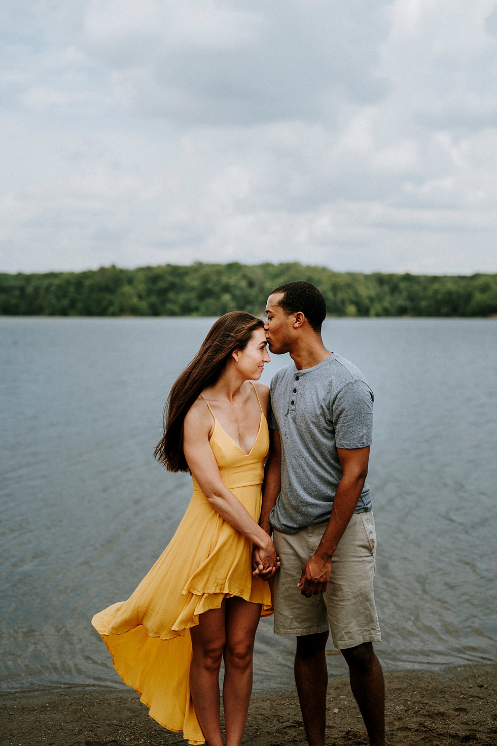  engagment session yellow dress kiss on the forehead engagment couple water background #engagementphotographer #louisvilleengagementphotographer #kentuckyengagmentphotographer #kentuckyengagments #engagementshoot #loveisintheair 