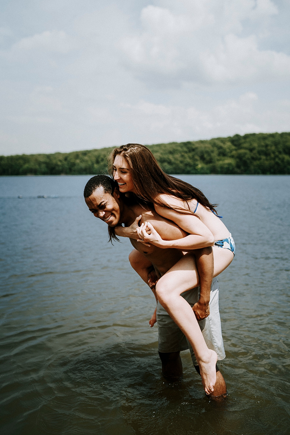  engagement photo shoot swim suits piggy back laughter deam lake engagement session #engagementphotographer #louisvilleengagementphotographer #kentuckyengagmentphotographer #kentuckyengagments #engagementshoot #loveisintheair 