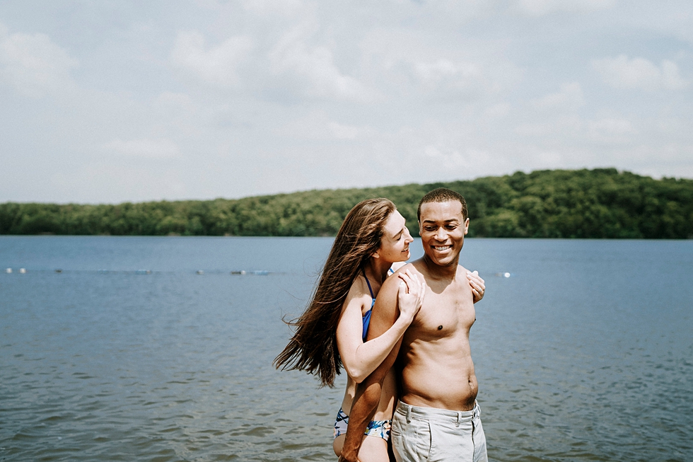  bright smiles deam lake engagement photos engagement session swim suits smiling together hug from behind #engagementphotographer #louisvilleengagementphotographer #kentuckyengagmentphotographer #kentuckyengagments #engagementshoot #loveisintheair 
