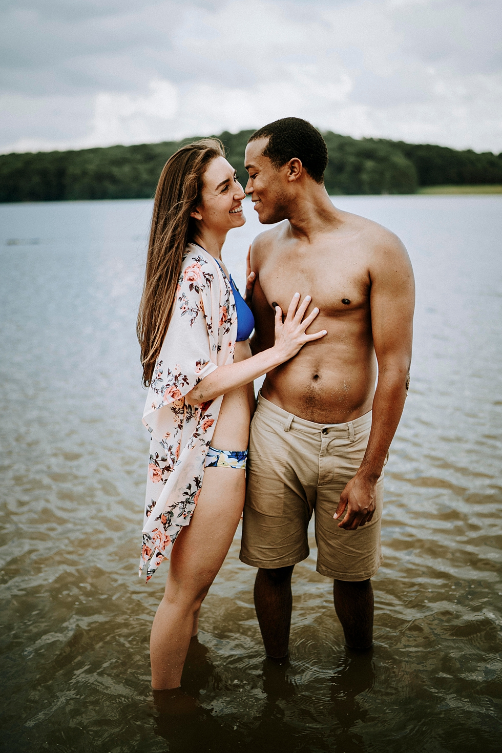  deams lake engagement photo shoot couple floral swim suit cover up smiling together arm in arm #engagementphotographer #louisvilleengagementphotographer #kentuckyengagmentphotographer #kentuckyengagments #engagementshoot #loveisintheair 