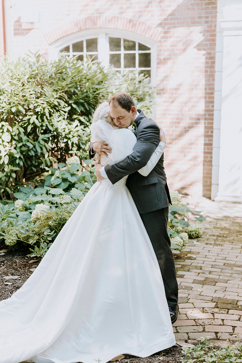  Father of the bride first look and embrace bride in simplistic sleek beautiful wedding gown #weddingphotographer #broaduschapel #weddingdaybliss #louisvillephotographer #kentuckyweddingphotographer #weddingsession #photographyanddesignbylauren #wedd