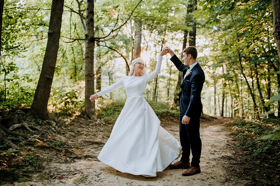  bride and groom dancing in the woods southern wedding long sleeve sleek wedding gown #weddingphotographer #broaduschapel #weddingdaybliss #louisvillephotographer #kentuckyweddingphotographer #weddingsession #photographyanddesignbylauren #weddingcere