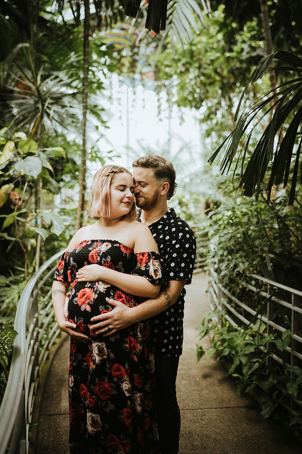  Expecting mom and dad craddling their growing baby at Krohn Conservatory #maternitygoals #maternityphotographer #babybump #outdoorphotosession #kentuckyphotographer #indianaphotographer #louisvillephotographer #maternityphotos #expectingababy #mirac