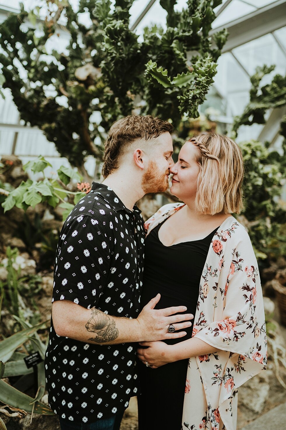  A kiss between these soon to be parents at Krohn Conservatory surrounded by foliage #maternitygoals #maternityphotographer #babybump #outdoorphotosession #kentuckyphotographer #indianaphotographer #louisvillephotographer #maternityphotos #expectinga