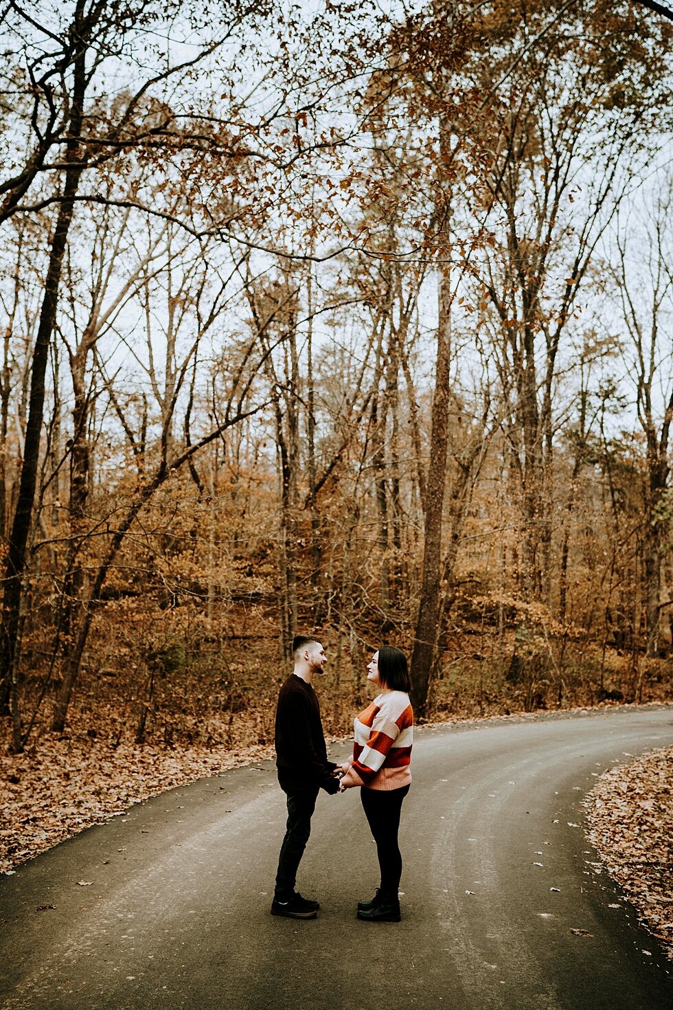  Middle of the road photo surrounded by trees with the engaged couple standing in the middle. #engagementgoals #engagementphotographer #engaged #outdoorengagement #kentuckyphotographer #indianaphotographer #louisvillephotographer #engagementphotos #s