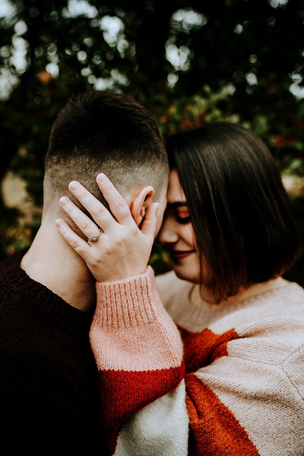  Engagement ring photo as the soon to be bride holds her hand against her fiance’s head and neck. #engagementgoals #engagementphotographer #engaged #outdoorengagement #kentuckyphotographer #indianaphotographer #louisvillephotographer #engagementphoto