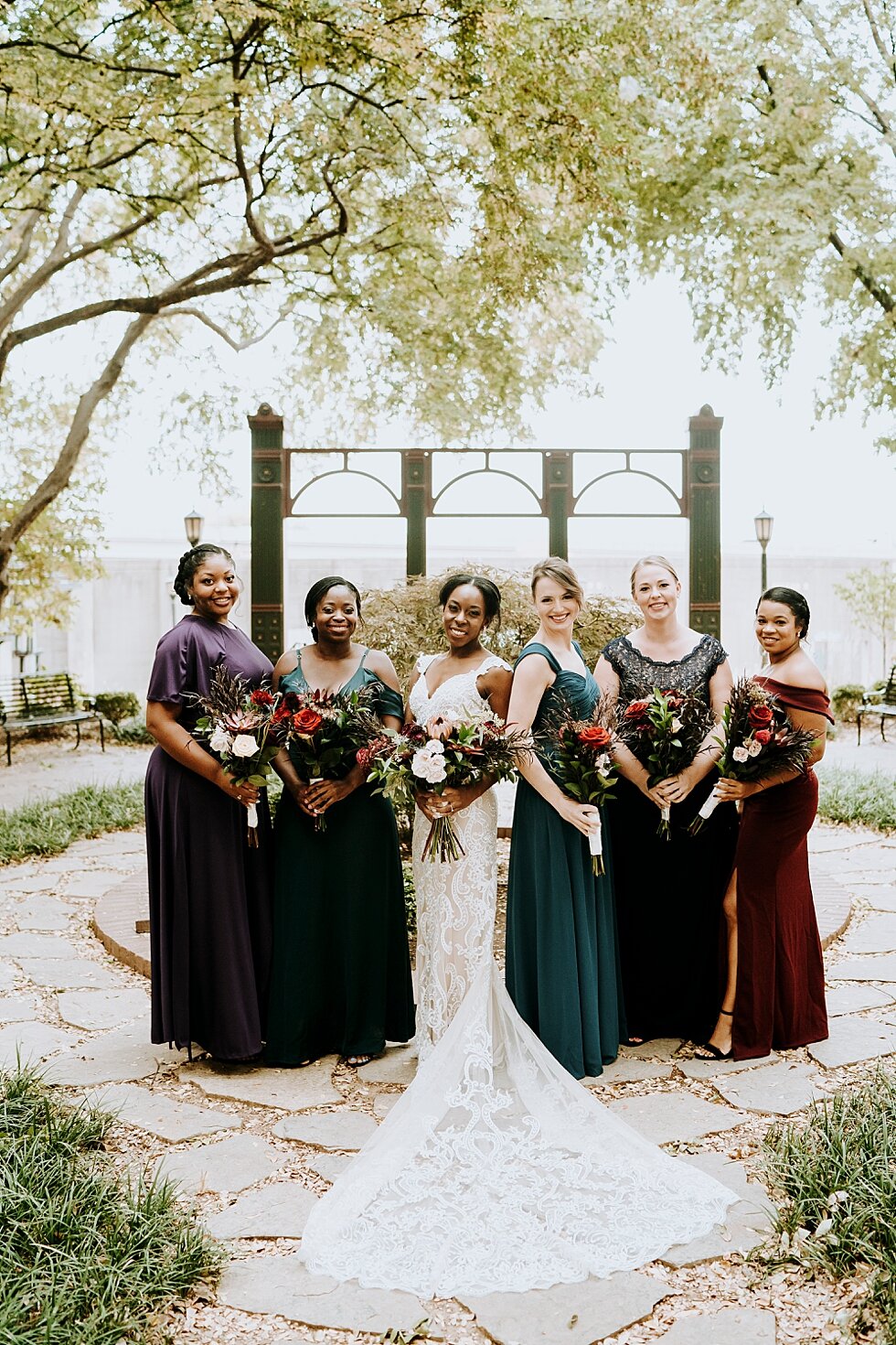  This stunning bride and her gorgeous bridesmaids wearing deep plum and emerald green. These jewel tones were stunning! #weddinggoals #weddingphotographer #married #ceremonyandreception #indianaphotographer #louisvillephotographer #weddingphotos #hus