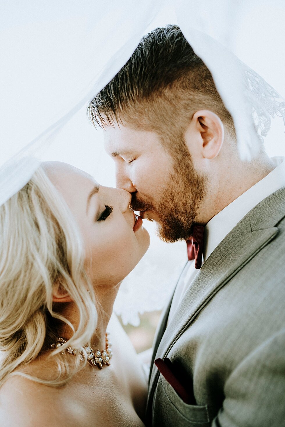  vintage wedding veil kissing photo bride and groom gorgeous western lace wedding gown sweetheart neckline #vintagebarn #westernwedding #midwayky #vintagewedding #horses #thatsdarling #weddingday #weddinginspiration #weddingphoto #love #justmarried #