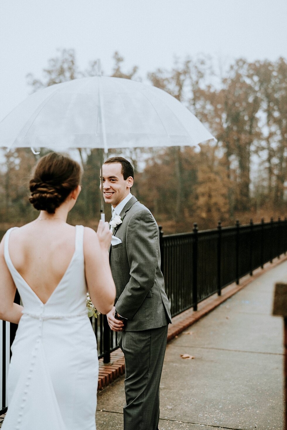  The first look turn showing the grooms face when he sees his gorgeous bride! rainy day wedding day umbrella #thatsdarling #weddingday #weddinginspiration #weddingphoto #love #justmarried #midwestphotographer #kywedding #louisville #kentuckywedding #