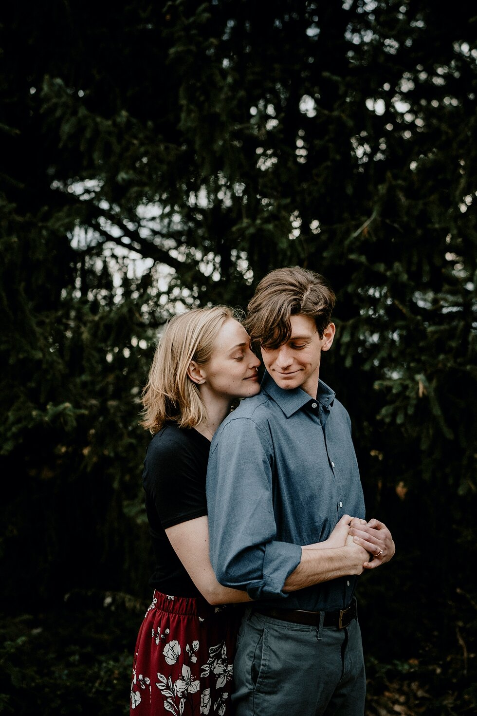  Contrasting the wide open photographs, this dark background made the couple stand out as they held each other close. Kentucky mountains red floral skirt dark black shirt cloudy skies engagement session Photography by Lauren outdoor #photographybylau