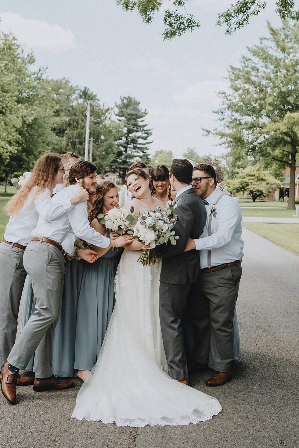  Bride and Groom having fun with their wedding party.  #thatsdarling #weddingday #weddinginspiration #weddingphoto #love #justmarried #midwestphotographer #kywedding #louisville #kentuckywedding #louisvillekyweddingphotographer #weddingbliss #wedding