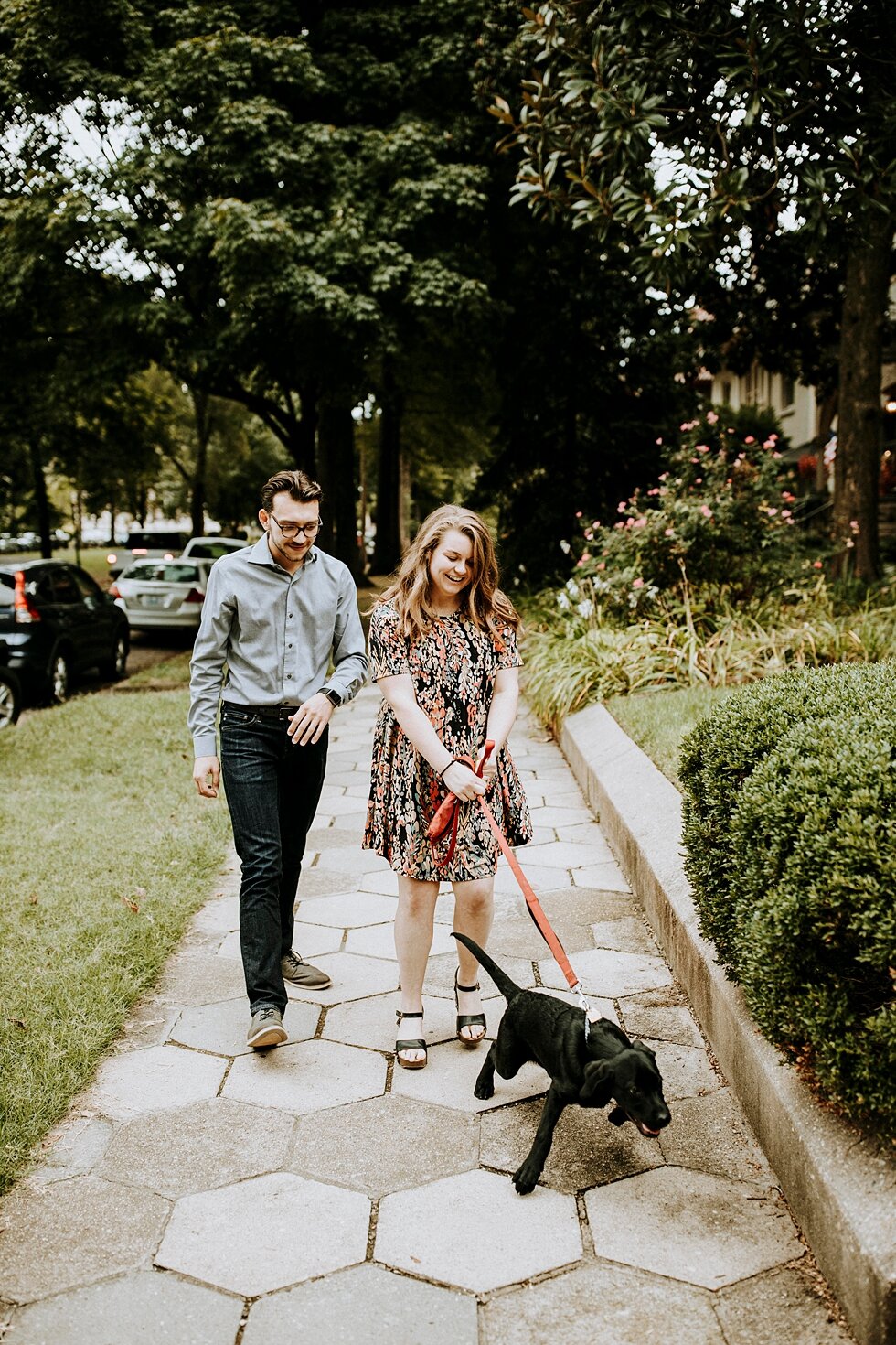  Engagement session with their dog walking down a stone path. getting married outdoor session engaged couple together wedding preparation love excited stunning relationship #engagementphotos #midwestphotographer #kywedding #louisville #stjamescourt #