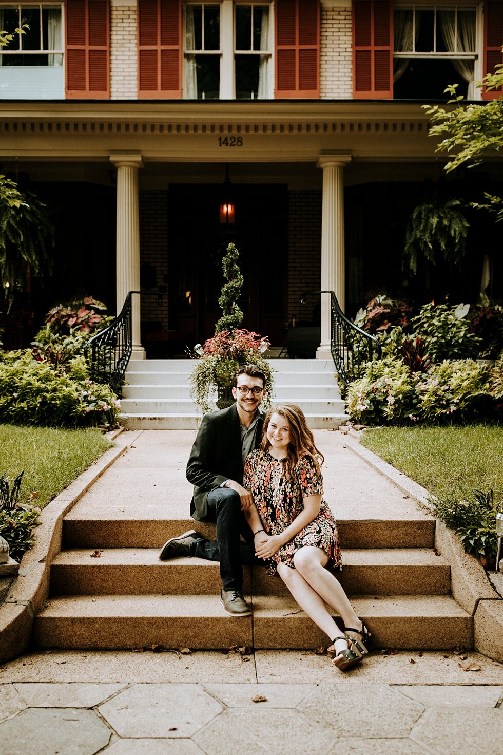 Couple sitting on the steps celebrating their engagement. getting married outdoor session engaged couple together wedding preparation love excited stunning relationship #engagementphotos #midwestphotographer #kywedding #louisville #stjamescourt #sum