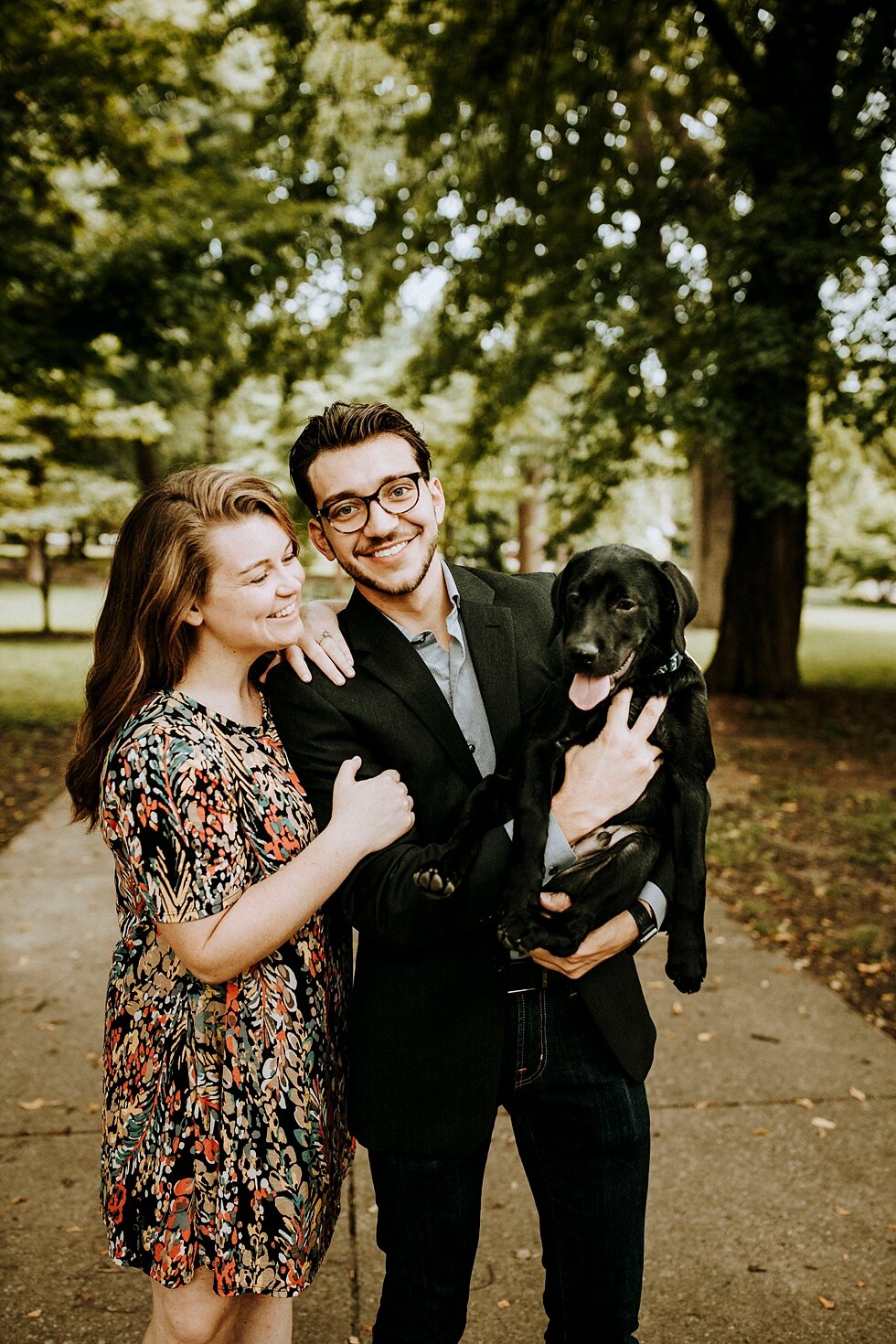  Engaged couple with their furry family member during their engagement session in Louisville, Kentucky. getting married outdoor session engaged couple together wedding preparation love excited stunning relationship #engagementphotos #midwestphotograp