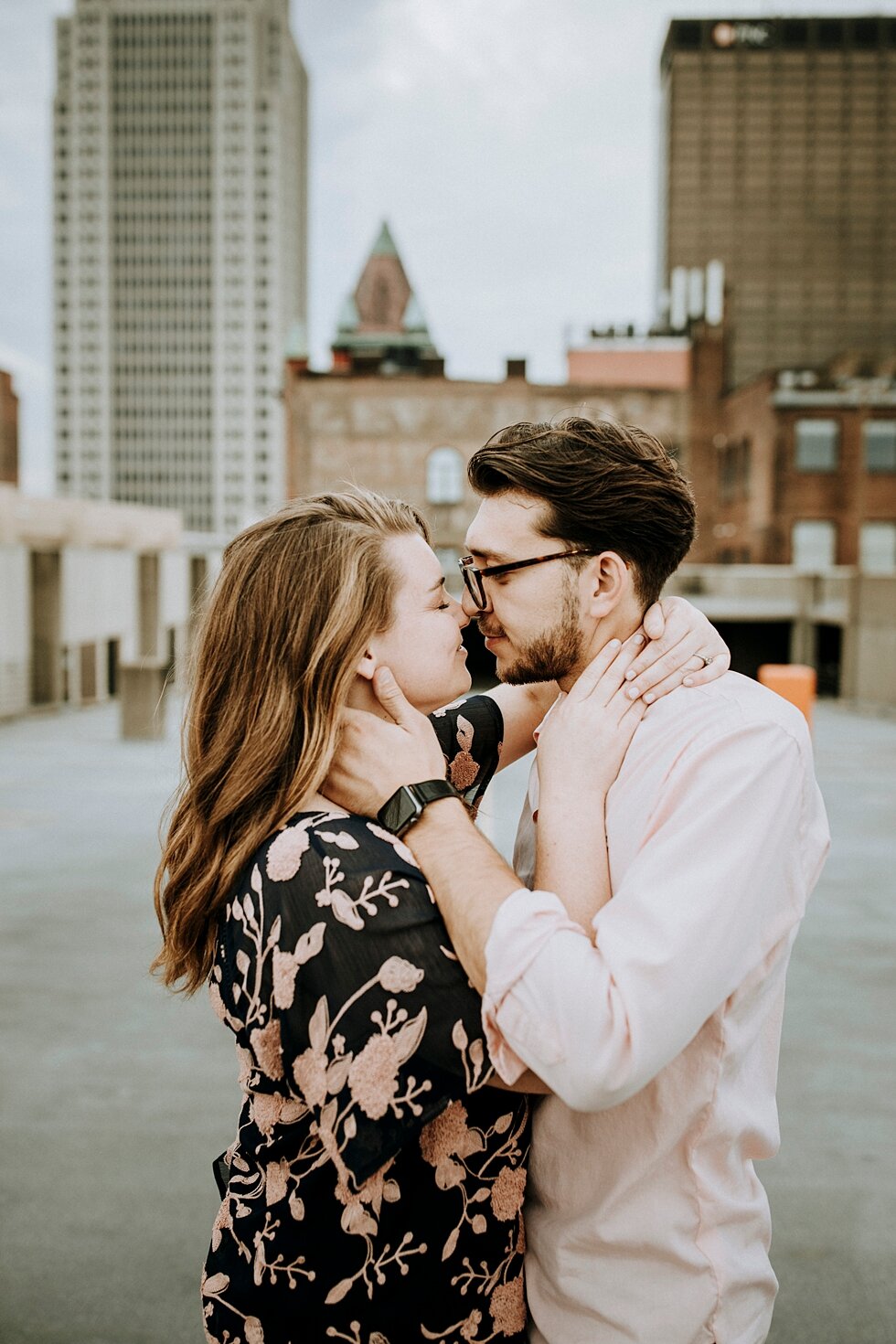 Rooftop engagement session capturing the tops of the buildings behind the engaged couple in Louisville, Kentucky. getting married outdoor session engaged couple together wedding preparation love excited stunning relationship #engagementphotos #midwe