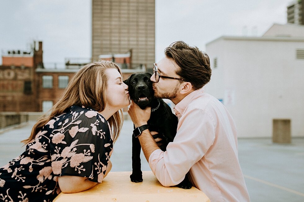  Kisses for the engaged couple and their black dog during their rooftop engagement session in Louisville, Kentucky. getting married outdoor session engaged couple together wedding preparation love excited stunning relationship #engagementphotos #midw