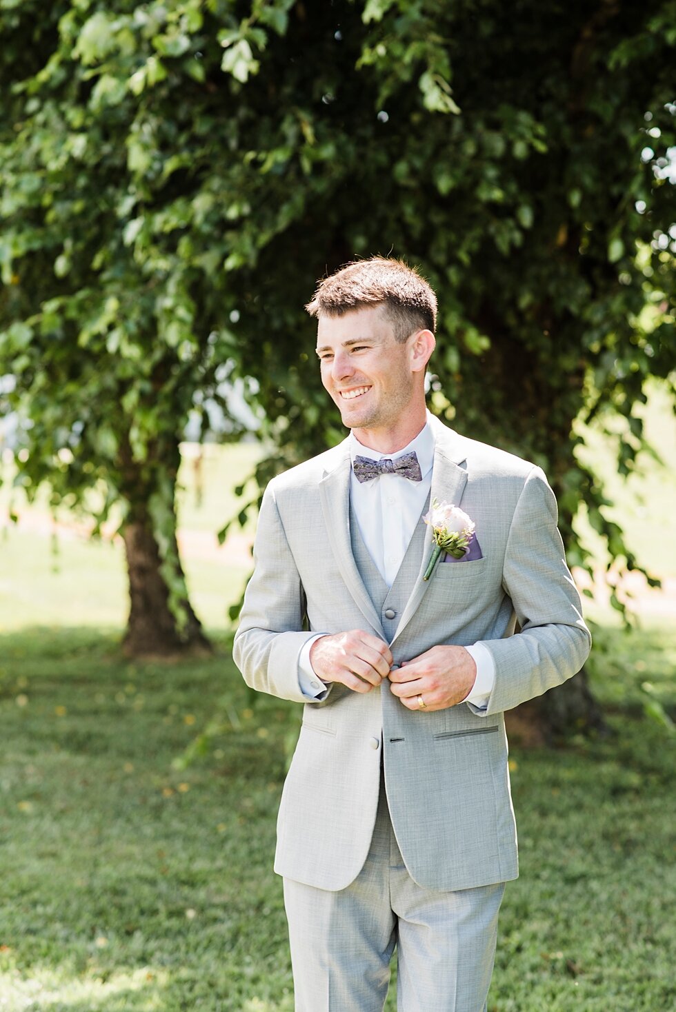  Smiling groom buttoning his jacket and waiting for his gorgeous bride. wedding ceremony details stunning photography married midwest louisville kentucky #weddingphoto #love #justmarried #midwestphotographer #kywedding #louisville #kentuckywedding #a