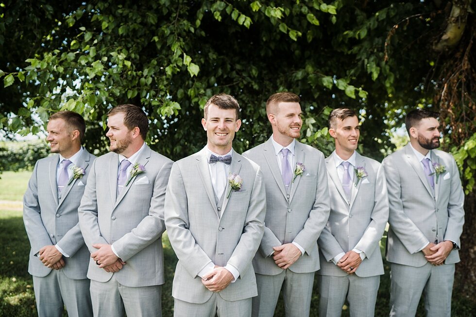  Groomsmen supporting their groom all dressed in grey suits and their hands clasped in front of them. wedding ceremony details stunning photography married midwest louisville kentucky #weddingphoto #love #justmarried #midwestphotographer #kywedding #