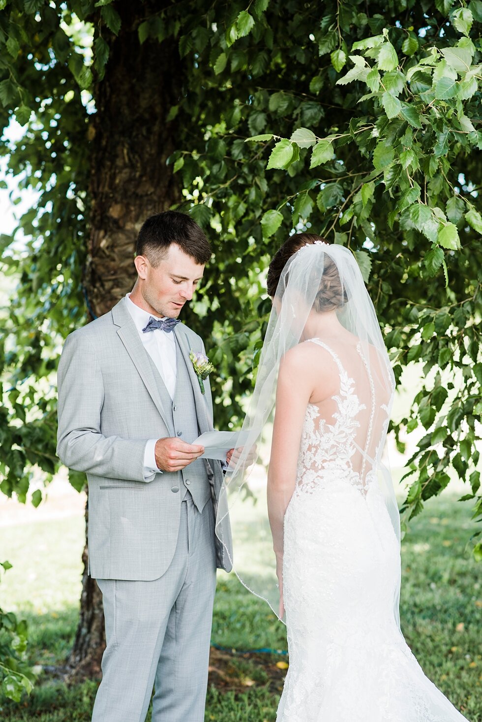  Emotional moment shared between the bride and groom before their wedding ceremony with the greenery in the background. wedding ceremony details stunning photography married midwest louisville kentucky #weddingphoto #love #justmarried #midwestphotogr