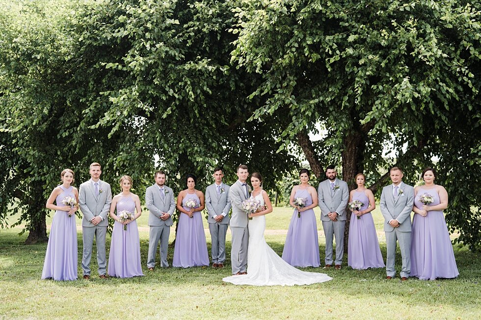  Wedding party at Huber Winery with the bridal party wearing lavender dresses and the groomsmen in grey suits. wedding ceremony details stunning photography married midwest louisville kentucky #weddingphoto #love #justmarried #midwestphotographer #ky