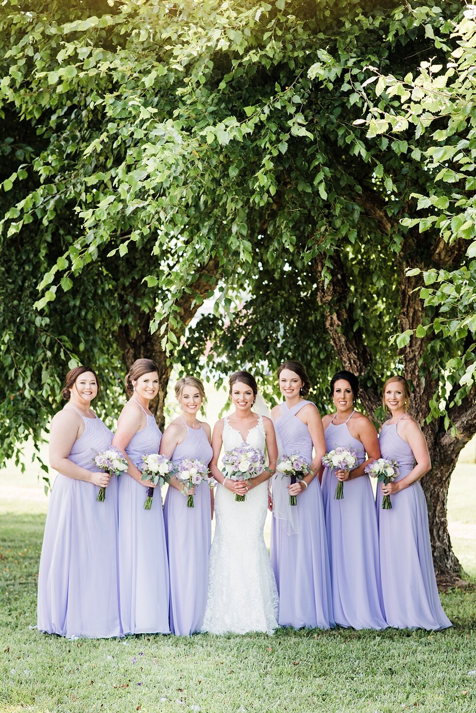  Bride smiles with her bridesmaids on wedding day as they support her on her big day. #thatsdarling #weddingday #weddinginspiration #weddingphoto #love #justmarried #midwestphotographer #kywedding #louisville #kentuckywedding #auburnkyweddingphotogra