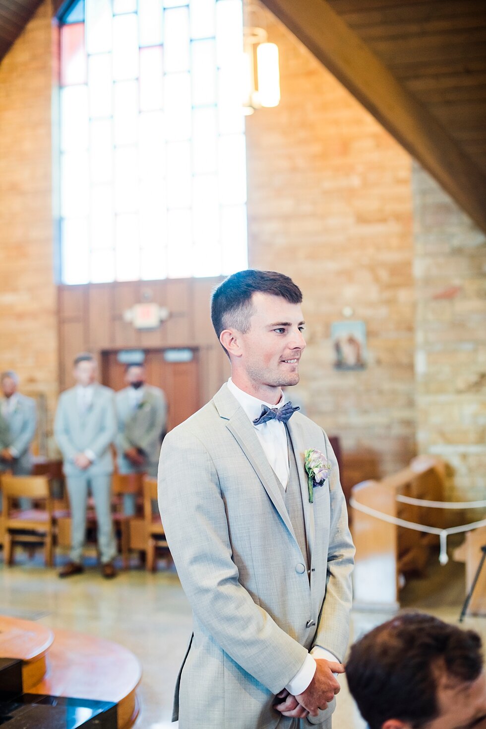  Groom waiting at the front of the wedding venue waiting for his bride to walk down the aisle with her father. wedding ceremony details stunning photography married midwest louisville kentucky #weddingphoto #love #justmarried #midwestphotographer #ky