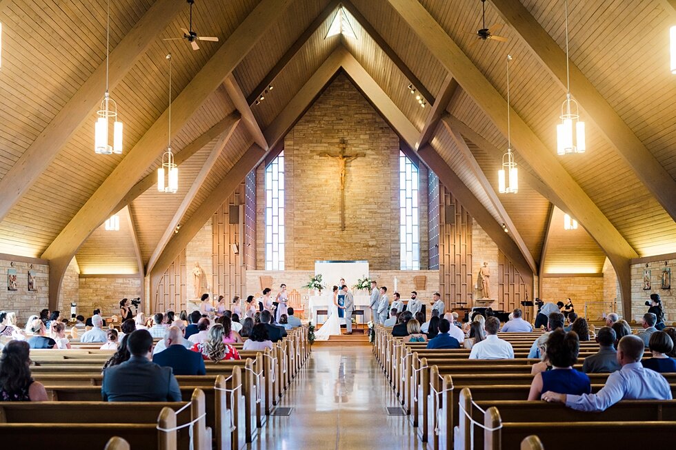  Stunning wedding venue with the guests filling in the pews waiting for the bride and groom to start their ceremony. wedding ceremony details stunning photography married midwest louisville kentucky #weddingphoto #love #justmarried #midwestphotograph