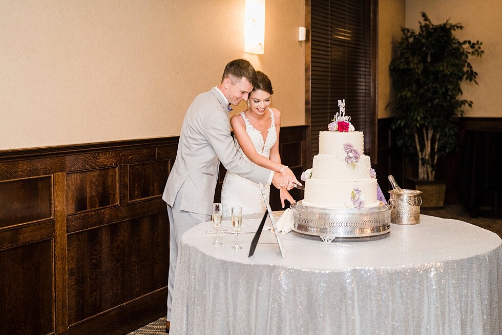  Bride and groom cutting the cake together during their wedding reception. wedding ceremony details stunning photography married midwest louisville kentucky #weddingphoto #love #justmarried #midwestphotographer #kywedding #louisville #kentuckywedding