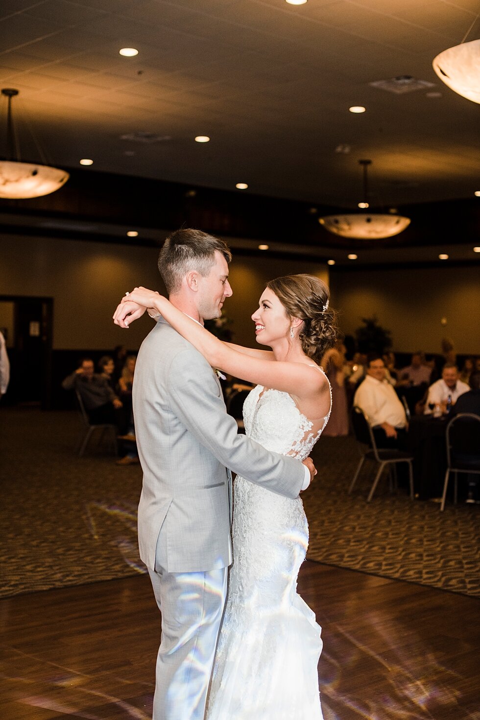  Swaying side to side, the bride and groom share their first dance together during their wedding reception. wedding ceremony details stunning photography married midwest louisville kentucky #weddingphoto #love #justmarried #midwestphotographer #kywed