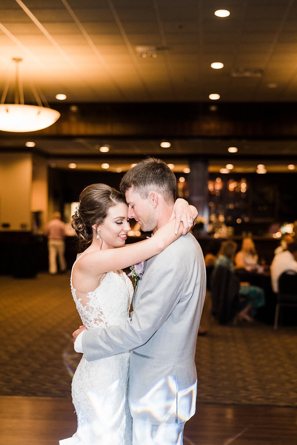  Bride puts her hands around the neck of her new husband as they share their first dance together as husband and wife. wedding ceremony details stunning photography married midwest louisville kentucky #weddingphoto #love #justmarried #midwestphotogra