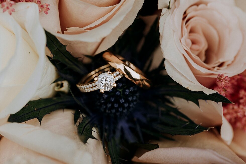  Wedding ring laid perfectly in a light pink and mauve wedding bouquet at The Refinery in Jeffersonville, Indiana. the refinery jeffersonville indiana covid wedding outside wedding midwest louisville kentucky #weddingphoto #justmarried #midwestphotog