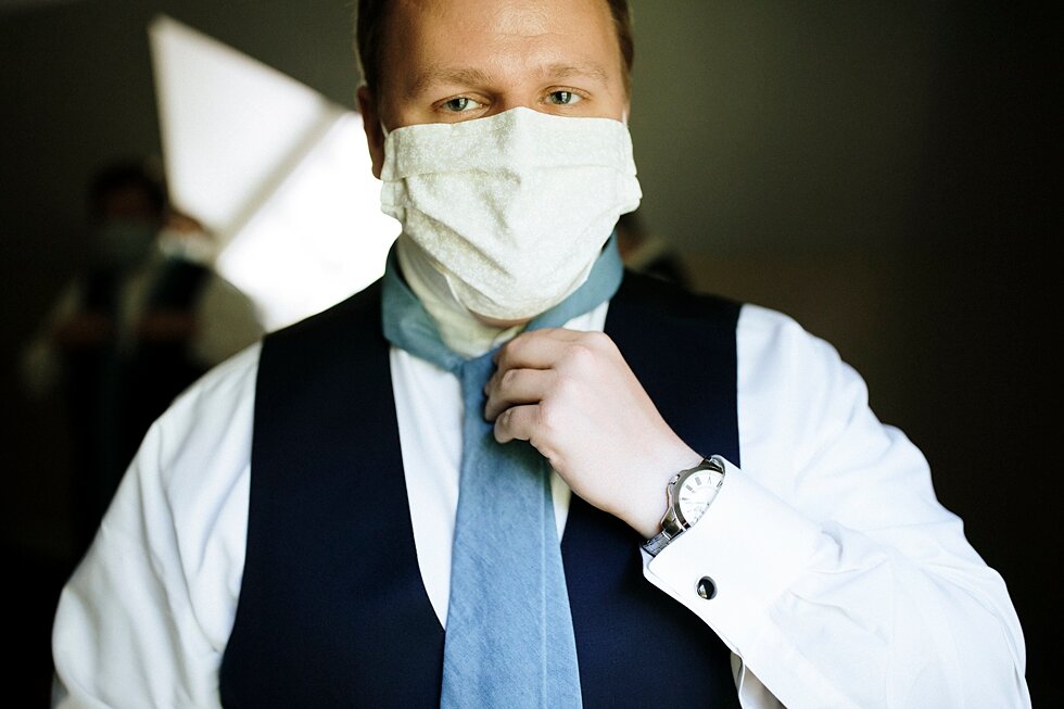  groom getting ready and adjusting mask  #thatsdarling #weddingday #weddinginspiration #weddingphoto #love #justmarried #midwestphotographer #kywedding #louisville #kentuckywedding #louisvillekyweddingphotographer #weddingbliss #weddingformals #lovei