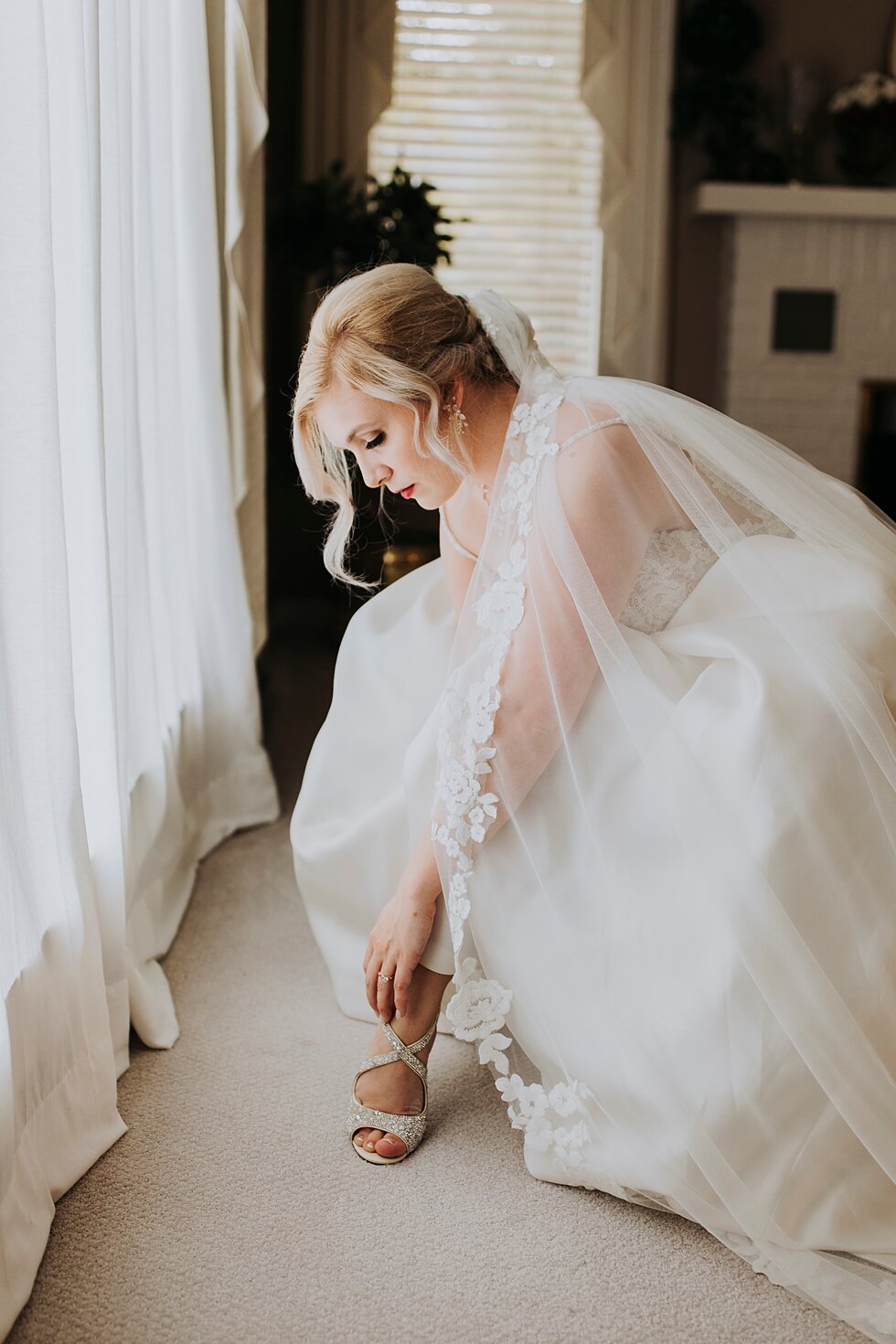 Bride getting ready and putting on shoes #thatsdarling #weddingday #weddinginspiration #weddingphoto #love #justmarried #midwestphotographer #kywedding #louisville #kentuckywedding #louisvillekyweddingphotographer #weddingbliss #weddingformals #lov