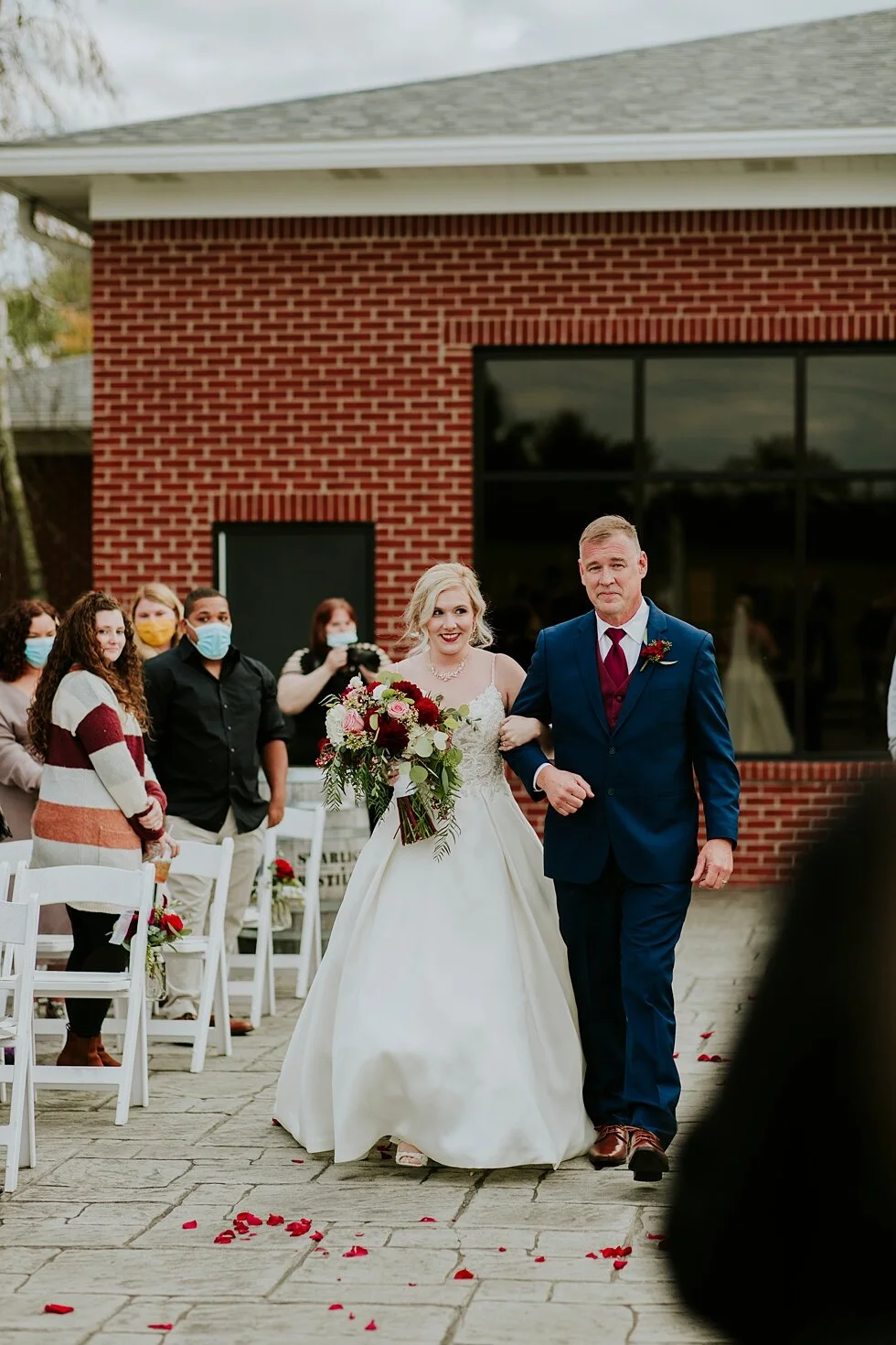 Bride walking down aisle with father at Huber’s Orchard and Winery #thatsdarling #weddingday #weddinginspiration #weddingphoto #love #justmarried #midwestphotographer #kywedding #louisville #kentuckywedding #louisvillekyweddingphotographer #wedding