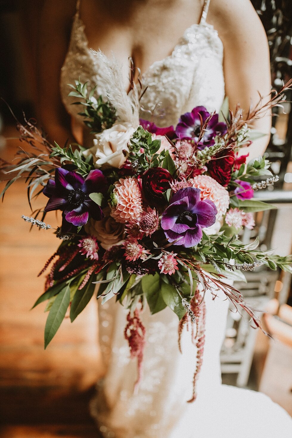  beautiful purple and pink wedding bouquet against beaded wedding dress  #thatsdarling #weddingday #weddinginspiration #weddingphoto #love #justmarried #midwestphotographer #kywedding #louisville #kentuckywedding #louisvillekyweddingphotographer #wed