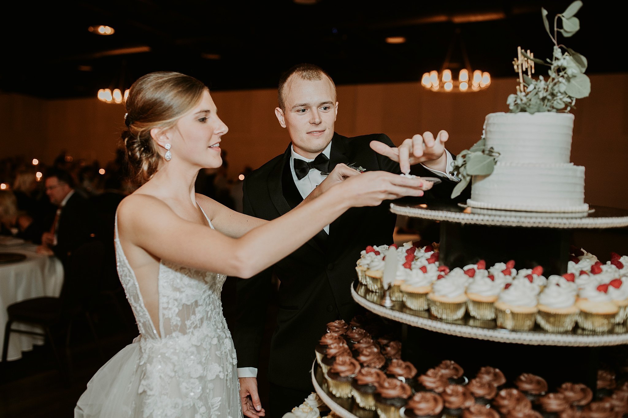  bride and groom cut cake at Romantic candle lit reception at venue 1408 jasper Indiana   #thatsdarling #weddingday #weddinginspiration #weddingphoto #love #justmarried #midwestphotographer #kywedding #louisville #kentuckywedding #louisvillekywedding