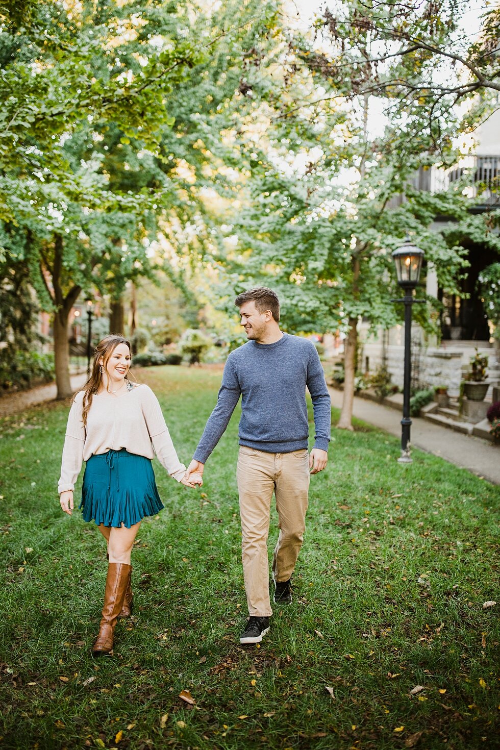  Walking hand in hand in St James enjoying the beautiful day. Louisville photographer engagements urban roof top anniversary romantic kentucky candles love #engagementphotos #savethedatephotos #savethedates #engagementphotography  #StJamesCourt #gard