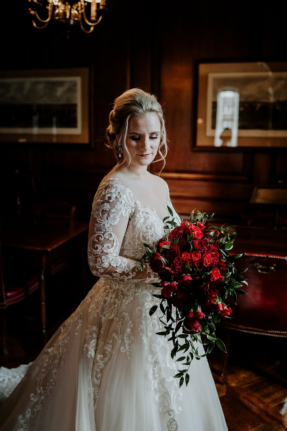  Divine portrait of the bride next to a glowing window on her wedding day just moments before she walks down the aisle to get married. Brisk February winter wedding Pendennis Club Louisville, Kentucky southern wedding bride and groom carefree wedding