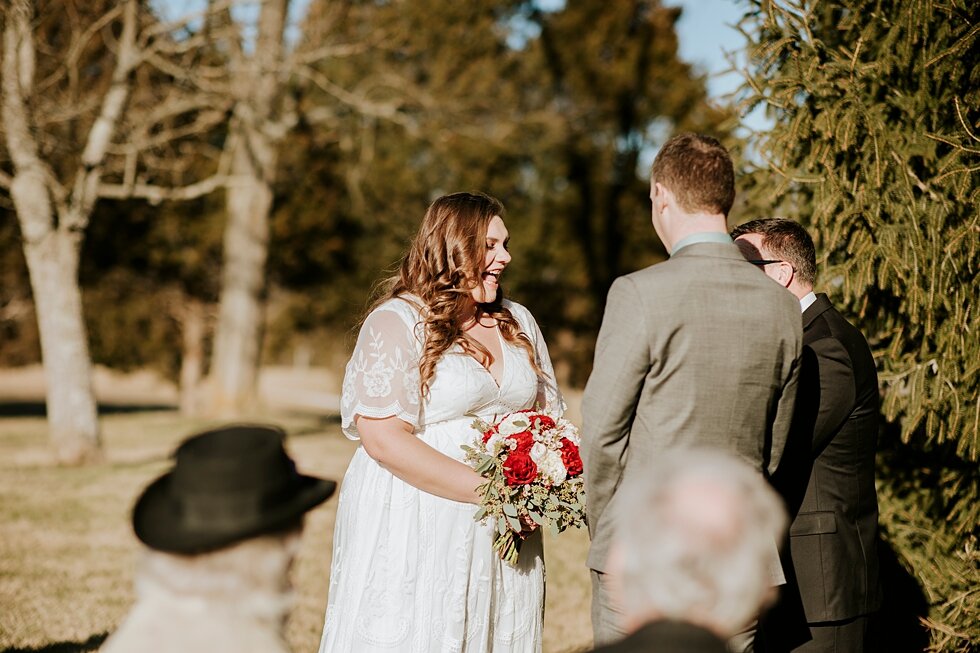  This stunning minimalist couple exchanged their vows as their guests gathered on hay bales in the backyard of the brides father on a wintery day in Indiana. Southern wedding Indiana intimate wedding small ceremony microceremony corydon indiana profe