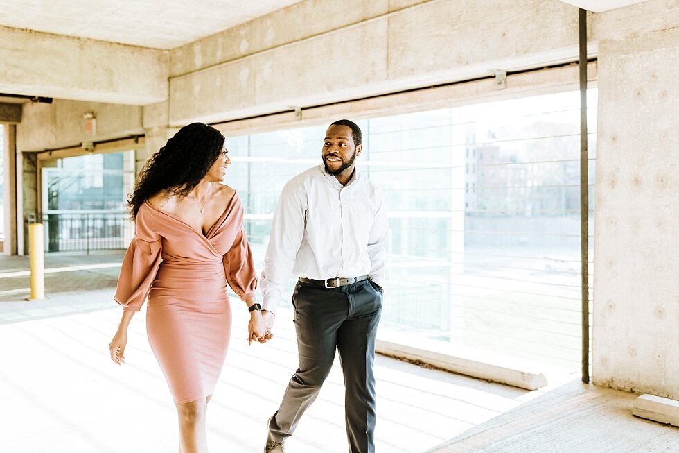  Stunning mauve dress and suite worn by an African American couple urban engagement pictures in downtown Louisville Muhammad Ali center and belvedere #engaged #muhumadalicenter #belvedere #shesaidyes #engaged #padbl #photographyanddesignbylauren #urb