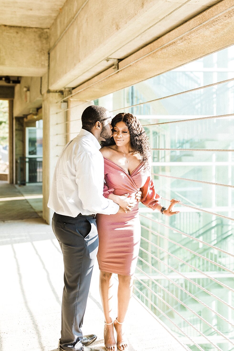  African American couple urban engagement pictures in downtown Louisville Muhammad Ali center and belvedere #engaged #muhumadalicenter #belvedere #shesaidyes #engaged #padbl #photographyanddesignbylauren #urban #city #urbanengagmentphotos #urbanengag
